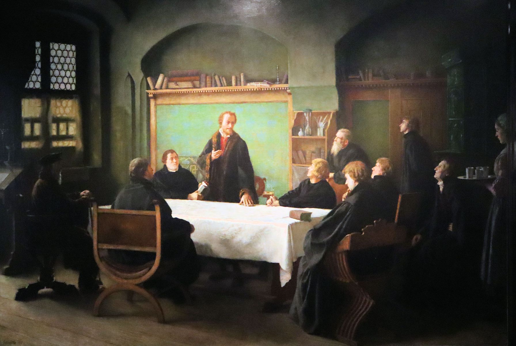 Melanchton lehrt, links neben ihm sitzt Luther, Bild im Melanchtonhaus in Wittenberg